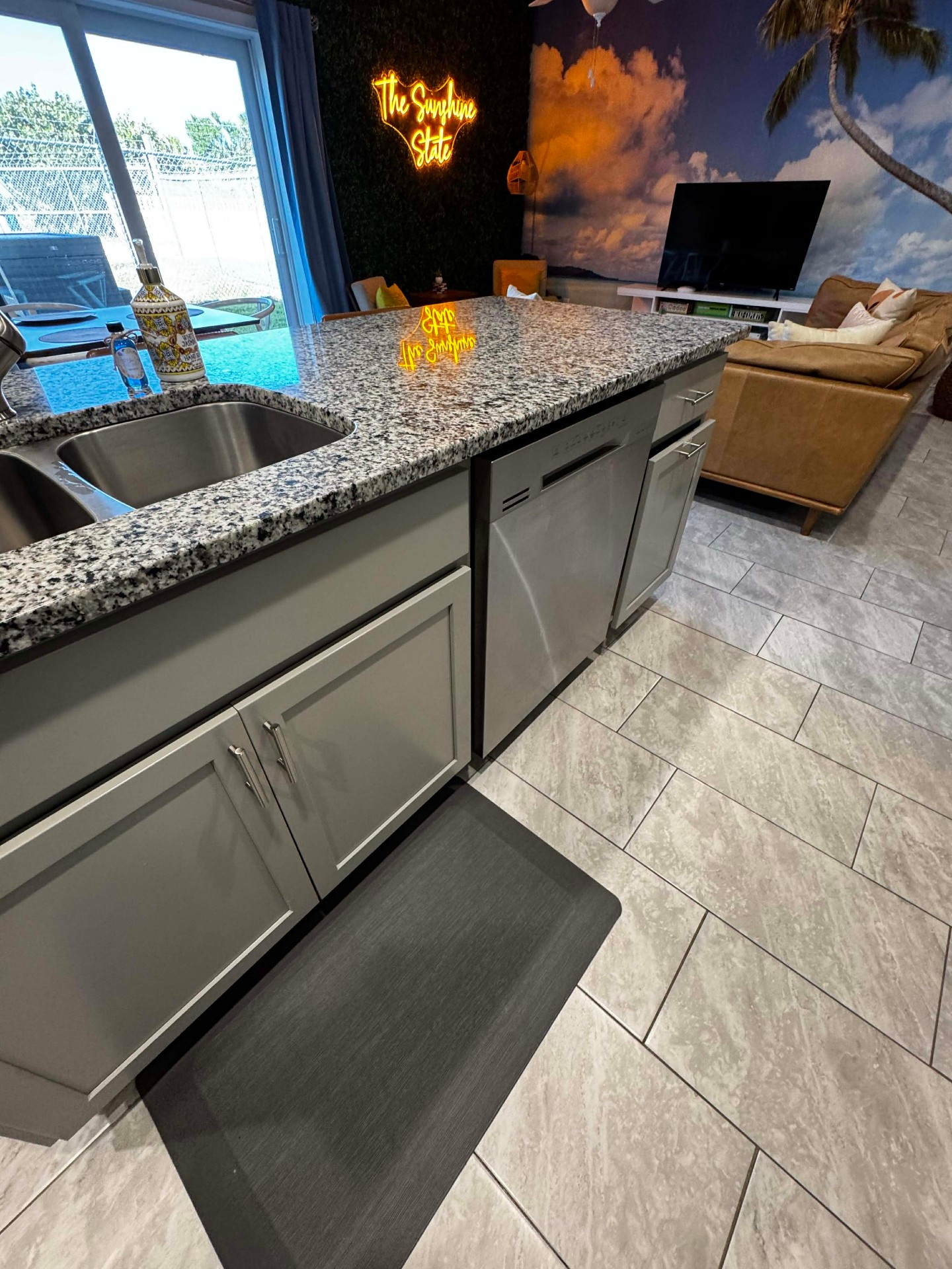 Spotless granite kitchen island and stainless appliances in a Daytona Airbnb cleaned by MOR Clean