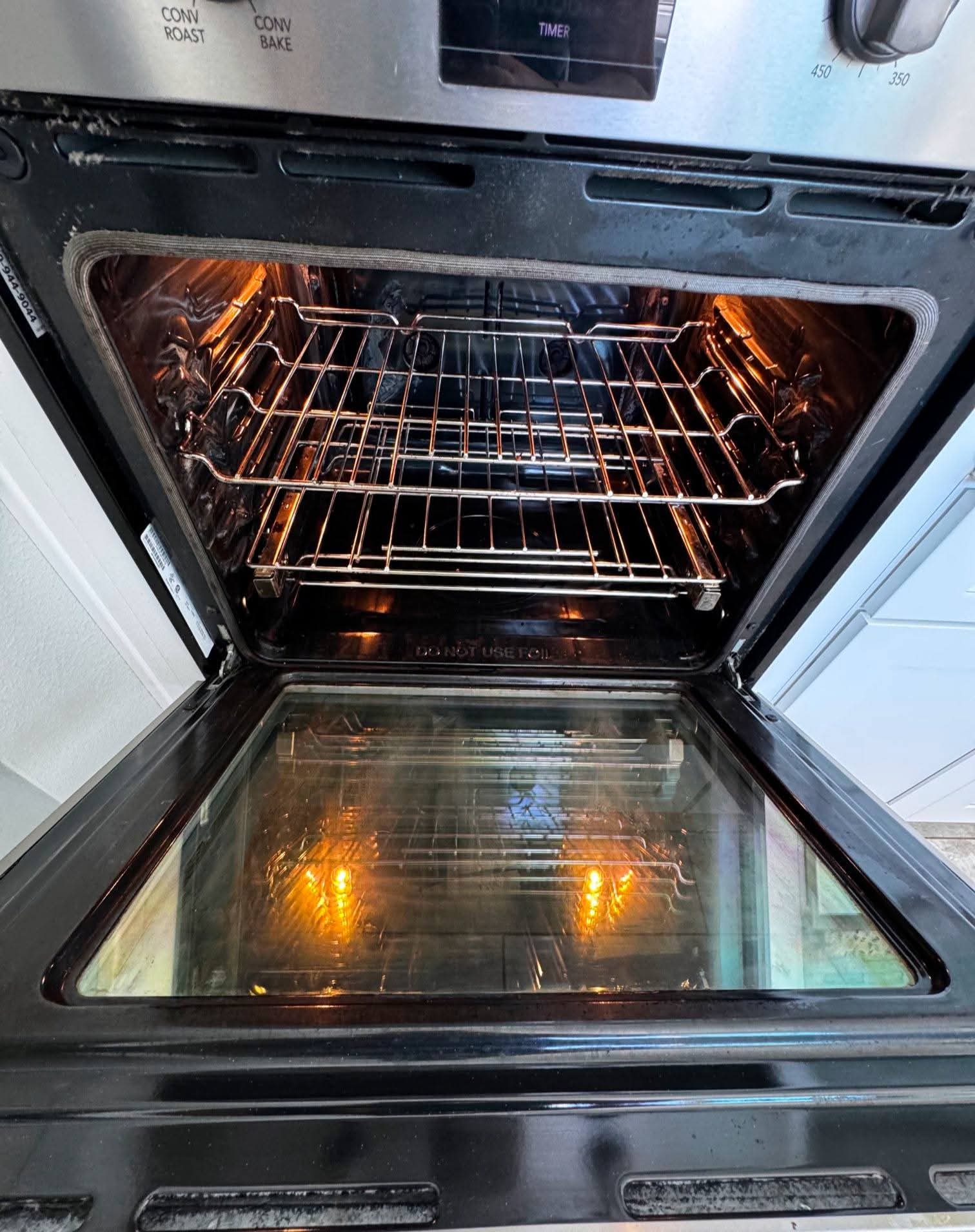Oven interior after MOR Clean deep clean — racks scrubbed, glass clear