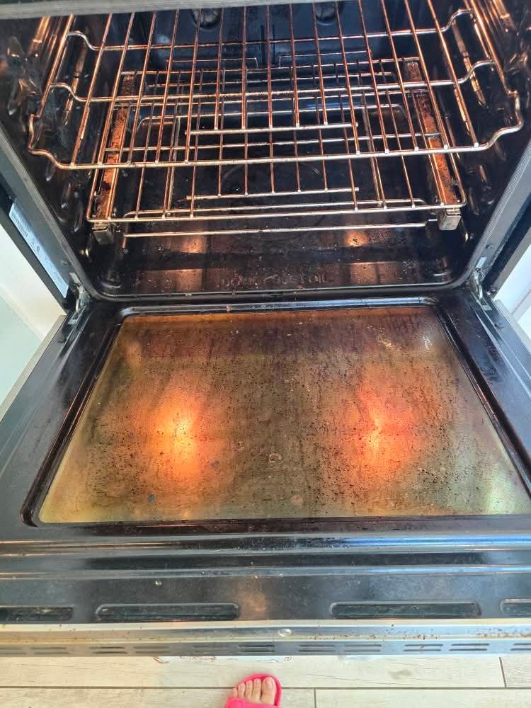 Oven interior before cleaning — heavy baked-on grease and grime